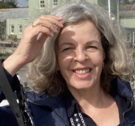 Julia, founder of Spirit Wise Reiki, smiling outdoors